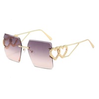 Lunettes de soleil de luxe pour femmes avec monture métallique, personnalisables avec logo, vente en gros