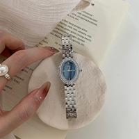 Montre à quartz vintage IEKE, best-seller transfrontalier, montre de luxe tendance ovale sertie de diamants pour femmes avec bracelet en acier fin