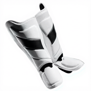 Protège-tibias en cuir véritable blanc avec accents noirs, fermeture auto-agrippante, protection légère, cadre métallique pour entraînement MMA universel - Product Image 1