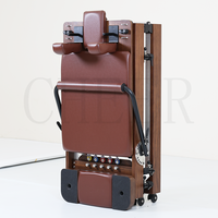 Lit de Pilates pliable professionnel haut de gamme en bois de chêne rouge massif avec finition noyer pour centre de fitness et équipement d'entraînement