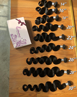 Paquets de vague de corps de qualité 10A couleur noire naturelle 12 ~ 40 pouces pour les femmes non traitées 100% cheveux humains vierges
