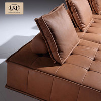 Canapé modulaire en cuir marron cognac, quatre pièces, en forme de L, avec assise capitonnée à grille et coussin de soutien, pour salon et appartement