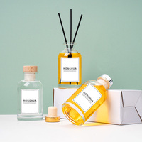 Vente en gros de flacons diffuseurs de parfum en verre ronds vides de 100 ml avec boîtes d'emballage personnalisées pour l'utilisation d'huiles essentielles