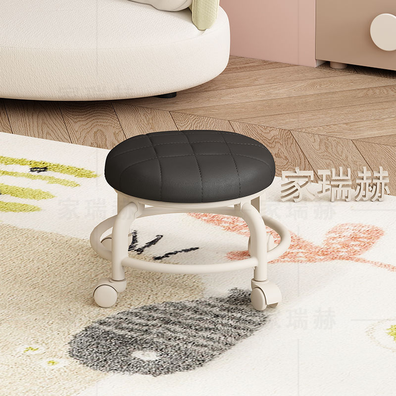 Cojín de asiento suave, redondo, grueso y texturizado en negro.