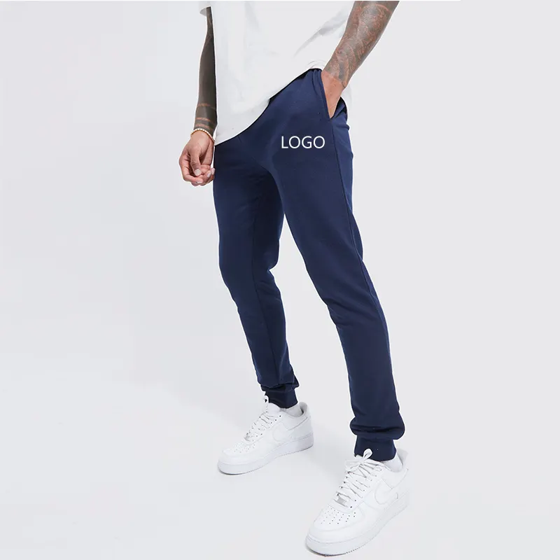 Fornitore OEM vendita calda tinta unita Unisex Casual Slim Fit elastico Logo personalizzato pantaloni sportivi impilati pantaloni da Jogging da uomo