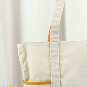 Bolsa de Lona Resistente y Lavable con Logotipo Personalizado, Ribete Naranja y Bolsillos Laterales, Ideal para el Trabajo, la Escuela y el Tiempo Libre - Product Image 2