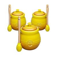 Pot de miel en céramique jaune avec louche pour le stockage des aliments et l'usine de conteneurs en gros 500ml