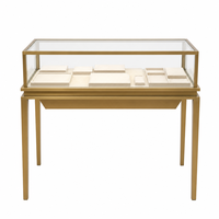 Vitrine à bijoux sur pied haut de gamme couleur or champagne, style musée moderne avec éclairage LED et dessus en verre verrouillable
