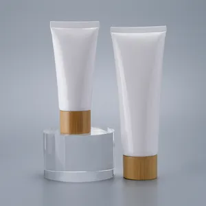 Emballage cosmétique en gros impression personnalisée 50g 60g 80g 100g 120g 150g Tube à presser en plastique blanc brillant avec couvercle à vis en bambou
