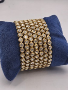Traditional gold-plated daily wear <b>bangles</b> featuring a sleek circular design adorned with white stones <b>set</b> - Product Image 4