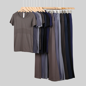 Set sportivo da <span class=keywords><strong>donna</strong></span> con tecnologia personalizzata e traspirante per il Fitness t-shirt pantaloni a zampa di mare in tinta unita per lo Yoga e lo Yoga - Product Image 1