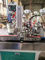 Machine à ourler et à perforer les bâches, tout-en-un