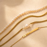 EMANCO Ensemble d'accessoires empilables en acier inoxydable style minimaliste avec accent perle, colliers chaîne cubaine, bracelets et boucles d'oreilles pendantes