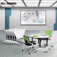 Table pliante modulaire de conférence GUANGWEI, forme trapézoïdale, en panneaux de bois écologiques, style moderne et minimaliste, pour salles de classe et formations.