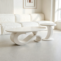 Ensemble de tables basses ovales de luxe léger avec plateau en dalle de pierre et structure métallique, tables gigognes minimalistes pour salon avec table d'appoint