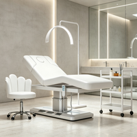 Table de massage électrique rose réglable pour spa avec trou facial et lumière LED, idéale pour salon de beauté (OEM)