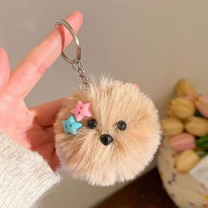Al por mayor: Llavero y colgante para mochila de perro de peluche con lazo, bola de pompón esponjosa y gafas, diseño de cachorro adorable - Product Image 6