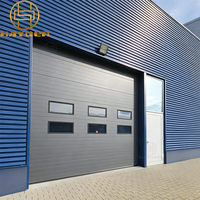 Porte sectionnelle industrielle motorisée en acier, résistante au feu, avec fenêtre, isolée, pour entrepôt chimique