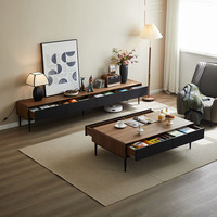 Ensemble meuble TV et table basse minimalistes modernes, pieds hauts, en noyer massif noir, style nordique luxueux, sur pieds.