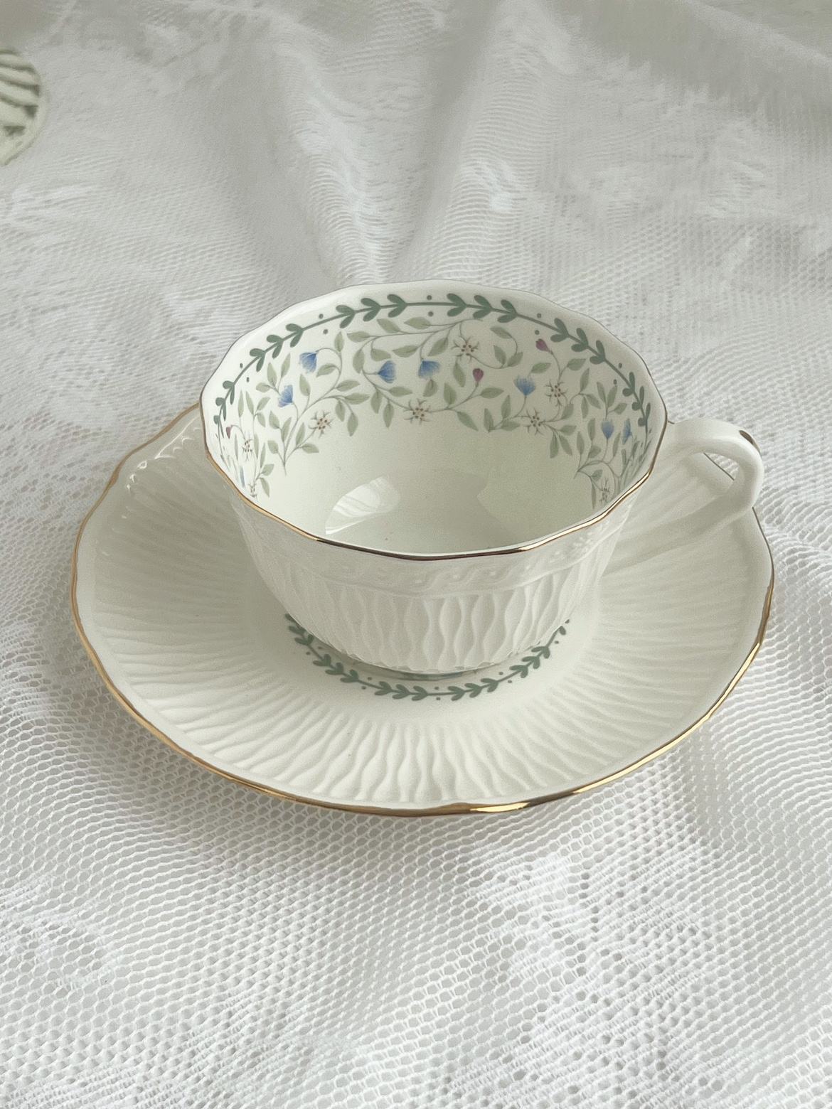 Green leaf coffee cup and saucer