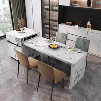 Îlot de cuisine mobile moderne en marbre avec panneau de rangement, style luxueux, fonction de refroidissement et table à manger