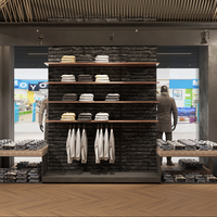 Présentoir de magasin de vêtements haut de gamme avec cabine d'essayage Étagères murales de vêtements en îlot en bois personnalisées vitrine en verre métallique