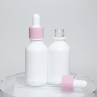 Bouchon rose avec 30ml 1oz Emballage cosmétique de luxe en or de haute qualité Bouteille en verre d'huile essentielle pour les yeux avec compte-gouttes