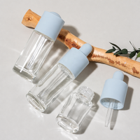 Botol Serum Kaca Bulat Bening 20ml 30ml dengan Dasar Tebal dan Pipet Tetes untuk Minyak Esensial dengan Logo Kustom