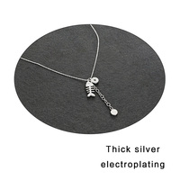 KINDLOVEHEART Collar de doble capa chapado en plata con colgante de circonita en forma de espina de pescado, cadena minimalista de dos niveles para mujer
