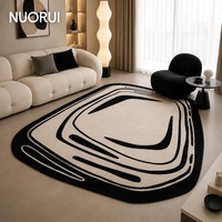 Tapis moderne noir et ivoire à motifs irréguliers, fait main, à poils coupés haut et bas, série design pour résidences de luxe et boutiques