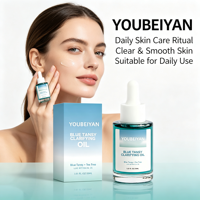 Marque propre, huile de teinture bronzante naturelle et biologique à l'arbre à thé et au jojoba, soin hydratant pour la peau, visage bleu.