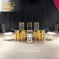Table et chaises de salle à manger de luxe 12 places base en acier inoxydable doré avec plateau en verre noir