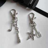 Porte-clés et breloques en métal, thème rock, guitare, étoile, casque audio, pour étuis d'écouteurs, sacs et accessoires, vente en gros