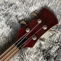 Guitare basse à 4 cordes de style ALEM personnalisée, manche traversant le corps, découpe en forme de cœur en bas