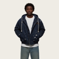 Veste streetwear en toile de coton premium 100% avec motif éclaboussures de peinture et bords effilochés, idéale pour un style urbain essentiel et un look robuste.