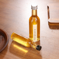 Bouteille en verre mini haute transparence de 50 ml et 100 ml avec étiquette personnalisée et bouchon en aluminium, conçue pour la bière, le brandy, les boissons énergisantes et le vin