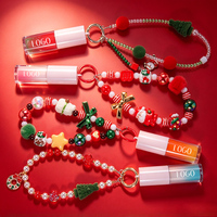 Porte-clés de Noël bicolore OEM, Huile à lèvres, Bracelet perlé, Breloque de fête, Hydratant à l'huile de Jojoba, Glisse douce, Repulpeur de lèvres personnalisé