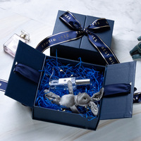 Boîtes en papier d'emballage cadeau biodégradables de luxe à double porte personnalisées rigides noires et bleues avec logo en relief