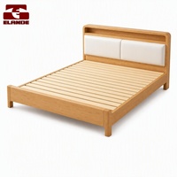Cadre de lit double moderne en bois avec tête de lit rembourrée et rangement, et lattes en pin silencieuses pour chambre à coucher