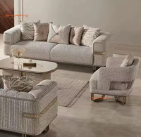 Canapé de luxe moderne en tissu haut de gamme avec décorations et pieds dorés, fourni directement par le fabricant pour le salon