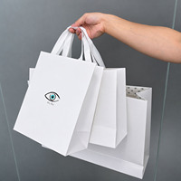 Custom Eye Graphic Printed Paper Bag White Satin Ribbon Handle for Jewelry Perfume Packaging