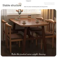 Ensemble table et chaises design moderne et épuré en fer et bambou, style corne de taureau, pour petits appartements et salons, vente en gros usine