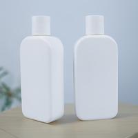 Bouteille plate en PE de 200 ml (6,76 oz) pour distributeur de lotion corporelle, conteneur de shampoing d'hôtel avec bouchon à disque