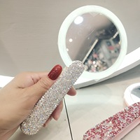 Vente en gros Nouveau miroir de maquillage rond de poche portable Miroir à main avec lumières LED