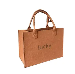 Vente en gros d'usine sac à bandoulière en feutre sac à main réutilisable de grande capacité simple sac fourre-tout femme filles avec logo fabricant de sac