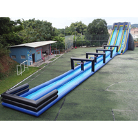 Toboggan aquatique gonflable géant bleu pour adultes de 10 m de haut avec double voie pour les fêtes d'été à la plage et à la piscine