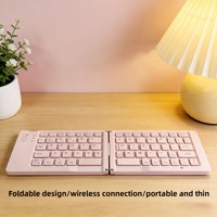 Nouveau mini clavier portable sans fil rechargeable à double pliage pour tablettes iPad et ordinateurs portables