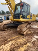 Excavatrice sur chenilles Komatsu PC1250HD de grande taille avec un puissant moteur de 775 ch. Les composants principaux incluent le moteur, la boîte de vitesses, la pompe à engrenages, le roulement, le PLC.