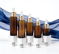 Großhandel Premium Bernsteinfarbene Glasfläschchen mit Gold/Silber Ring für Hautpflege-Serum