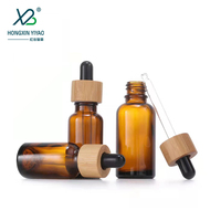 Bouteilles en verre en gros de 10 ml, 30 ml, 100 ml avec couvercles en bambou pour crème visage, gouttes pour les yeux, huile essentielle, mascara, compte-gouttes sérigraphié
